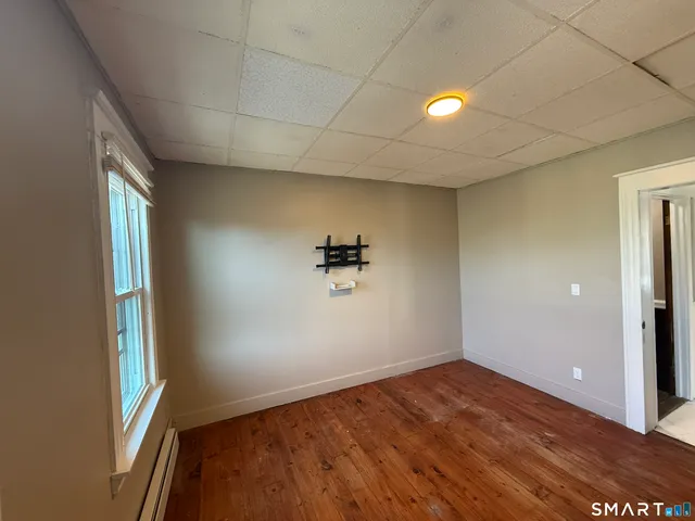 an empty room with a empty space and windows