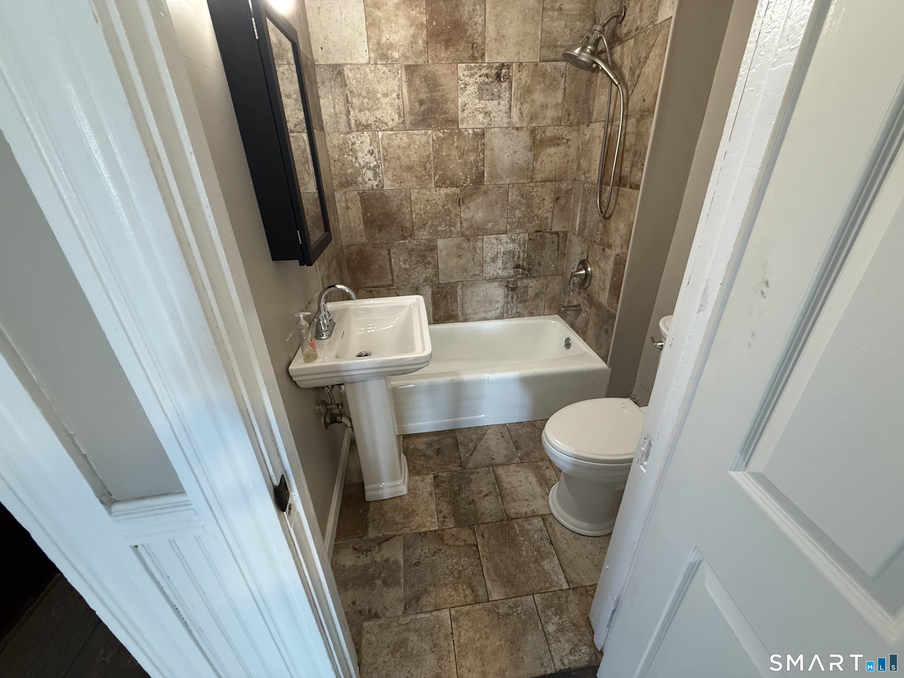 154 Daly Avenue, Unit 3 New Britain, CT 06051 - Photo 10 of 25 a bathroom with a sink and a toilet