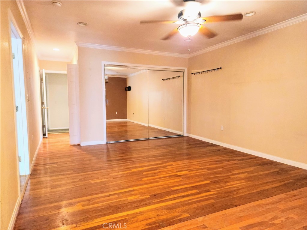 1325 West 34th Street Long Beach, CA 90810 - Photo 10 of 35 a view of an empty room with wooden floor