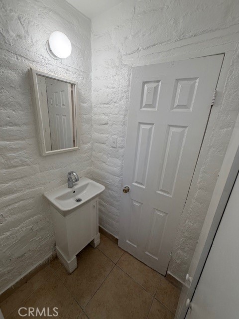 66351 First Street, Unit 2 Desert Hot Springs, CA 92240 - Photo 15 of 16 a bathroom with a sink a toilet and vanity