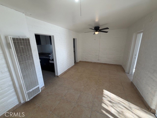 66351 First Street, Unit 2 Desert Hot Springs, CA 92240 - Photo 5 of 16 wooden floor in an empty room with a window