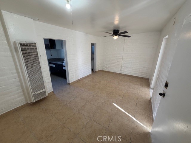 66351 First Street, Unit 2 Desert Hot Springs, CA 92240 - Photo 7 of 16 wooden floor in an empty room with a bathroom