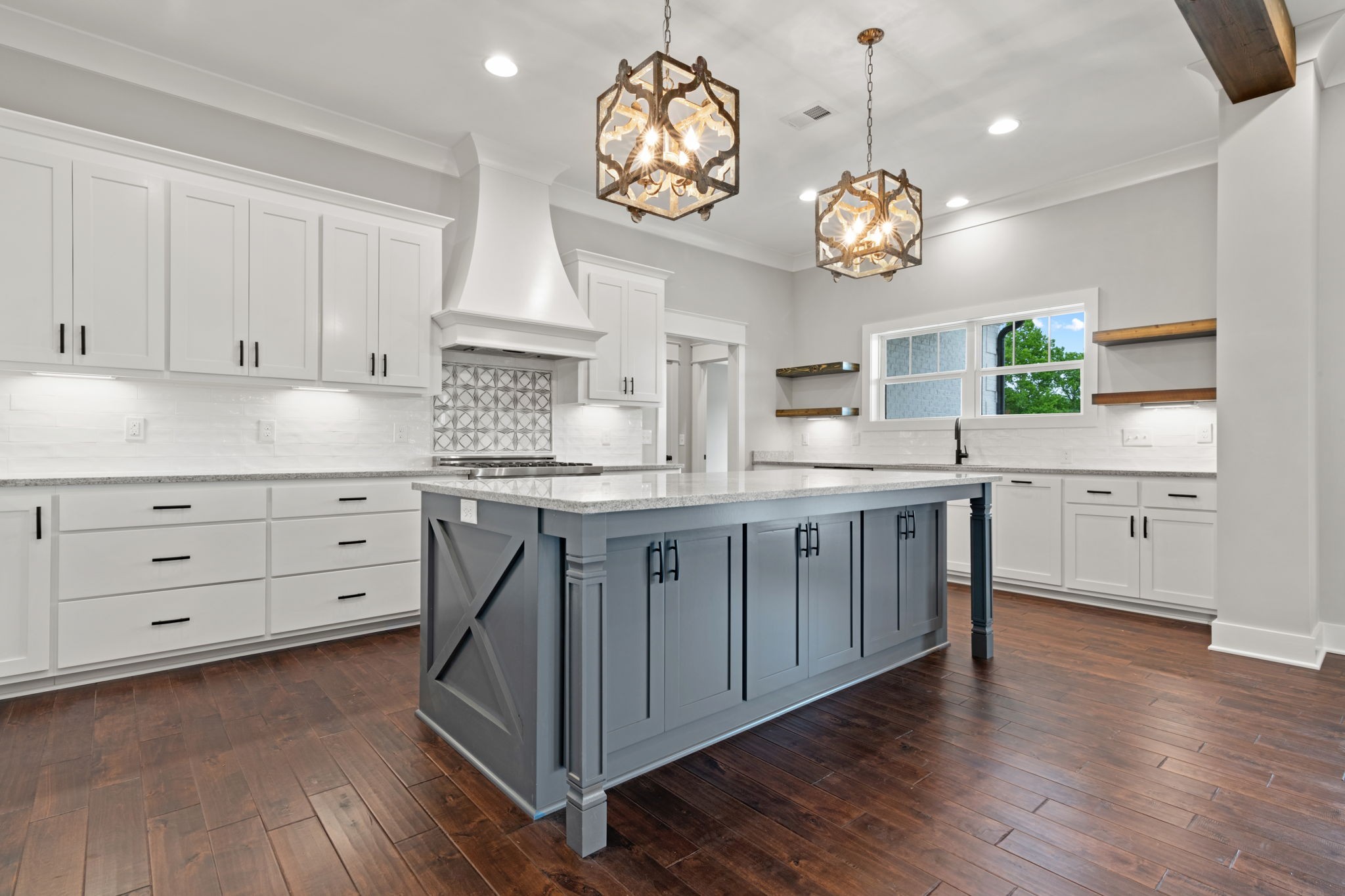 970 Cortner Road Normandy, TN 37360 - Photo 15 of 32 a kitchen with cabinets wooden floor and stainless steel appliances