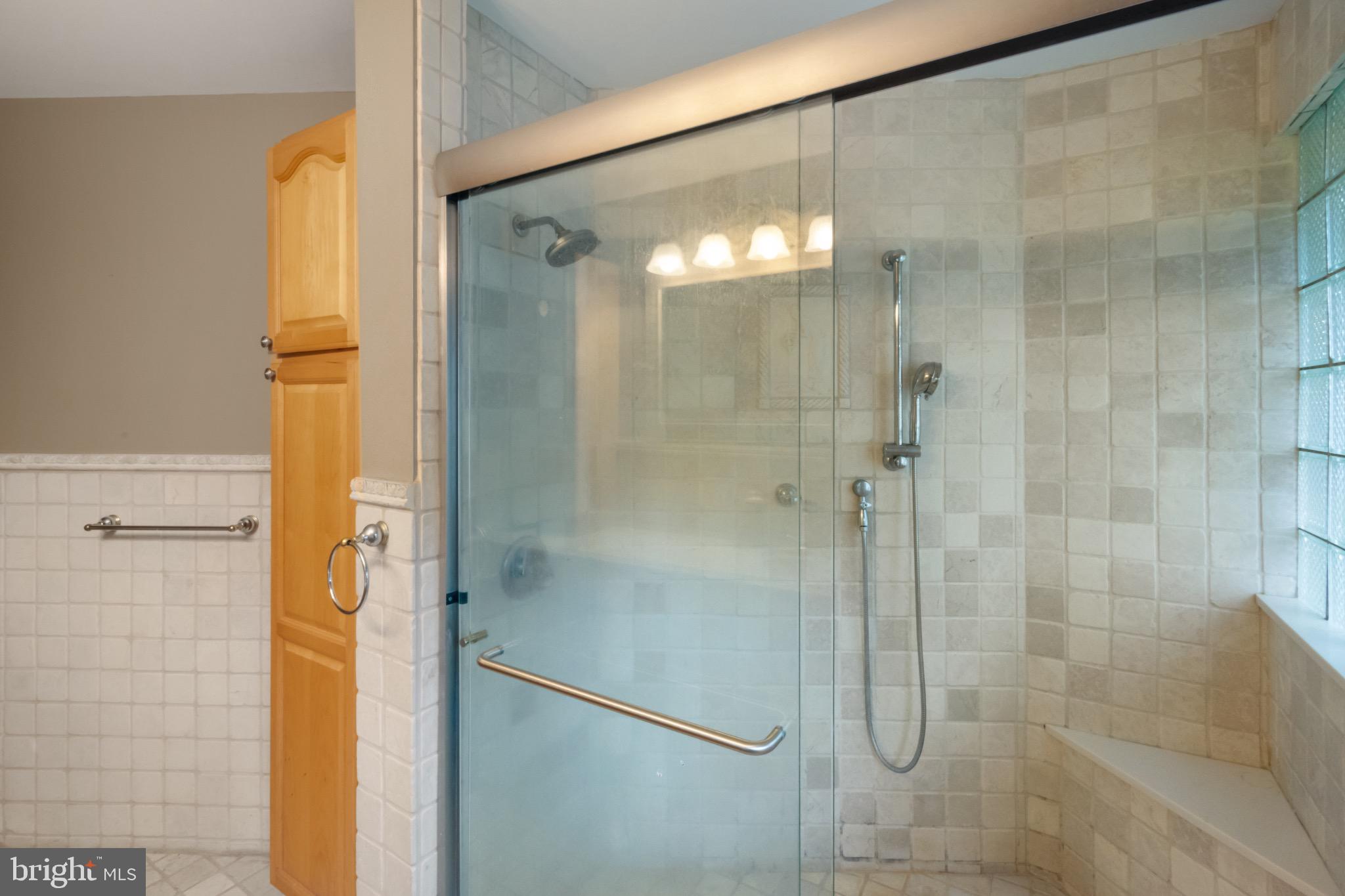 51 Christopher Mill Road Medford, NJ 08055 - Photo 13 of 24 Elegant glass shower in a serene bathroom.