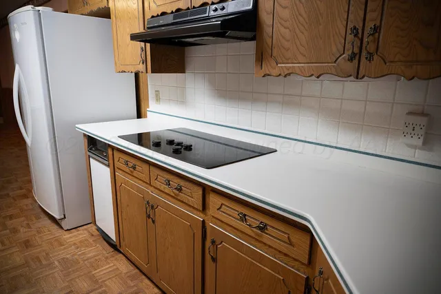 a close view of sink and cabinets