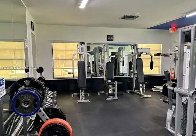 a view of a livingroom with furniture and a window