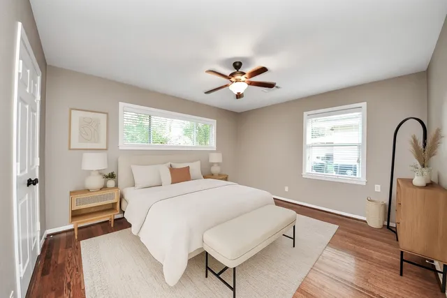 a bedroom with a bed and a window