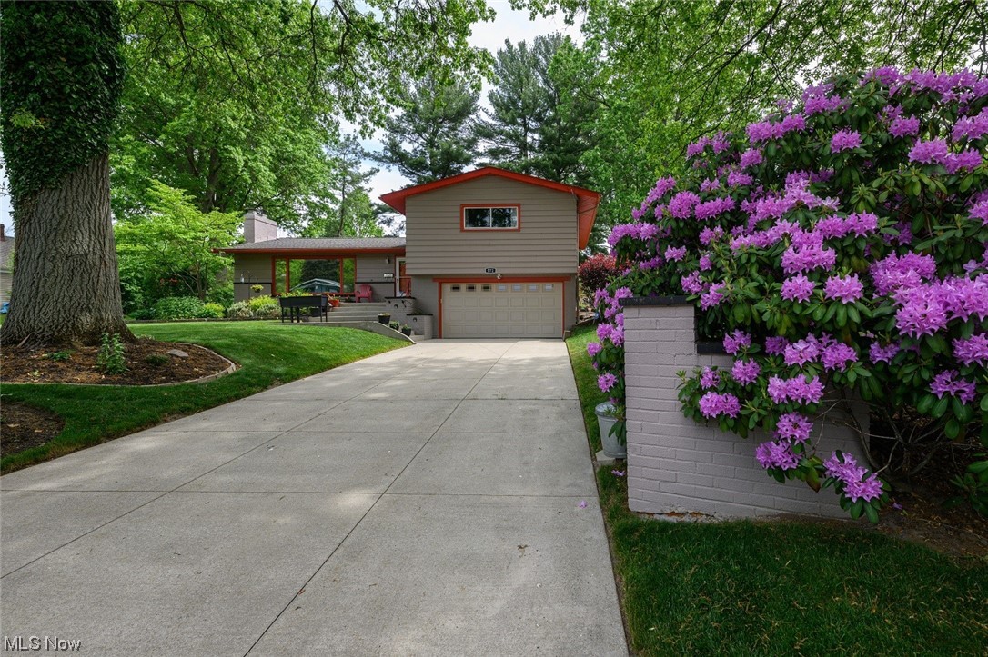 572 Overwood Road Akron, OH 44313 - Photo 2 of 35 View of front of property featuring garage and a front lawn