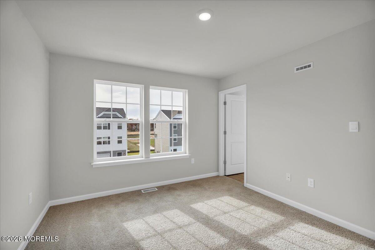 216 Sandy Rdg Road Sicklerville, NJ 08081 - Photo 13 of 24 an empty room with windows