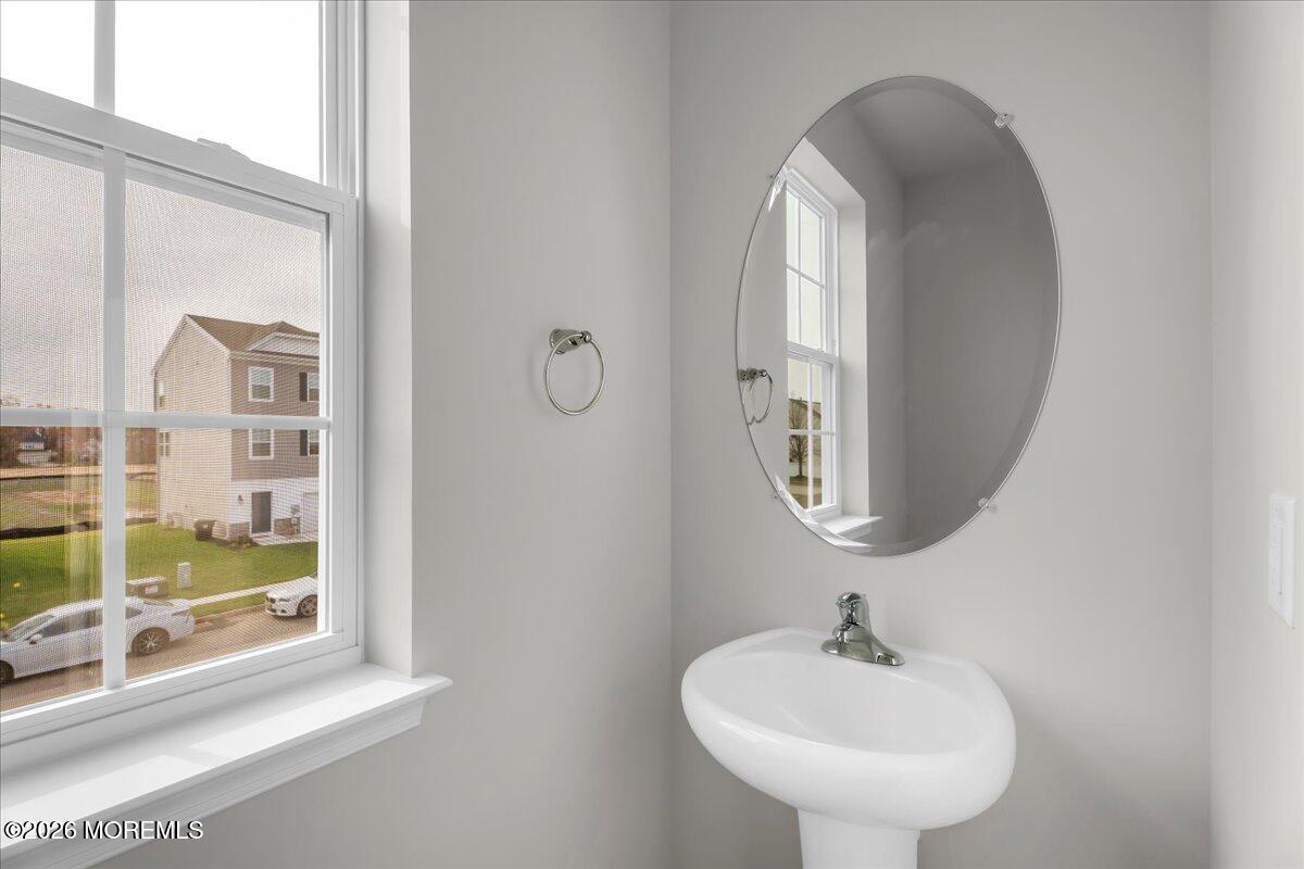 216 Sandy Rdg Road Sicklerville, NJ 08081 - Photo 14 of 24 a bathroom with a sink and a mirror