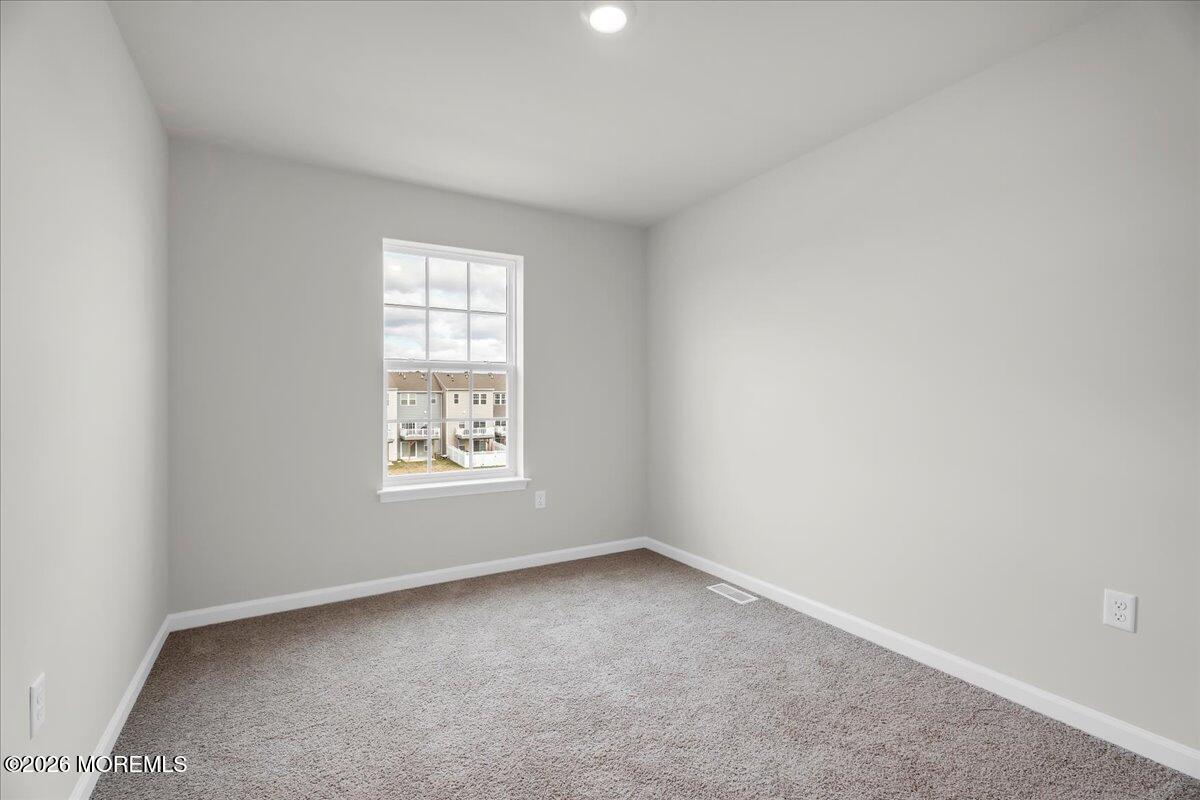 216 Sandy Rdg Road Sicklerville, NJ 08081 - Photo 20 of 24 an empty room with windows