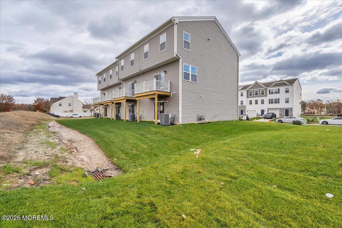 216 Sandy Rdg Road Sicklerville, NJ 08081 - Photo 23 of 24 a view of a house with a big yard and large trees