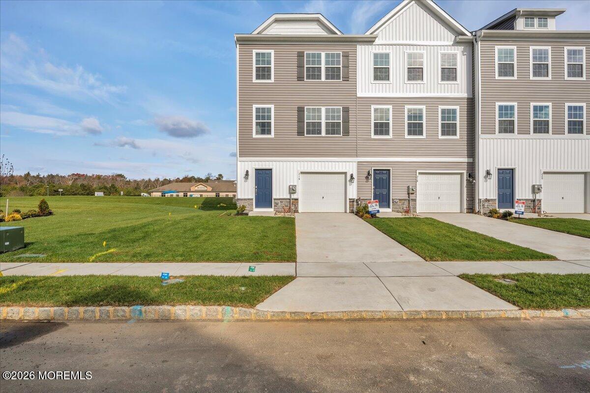 216 Sandy Rdg Road Sicklerville, NJ 08081 - Photo 3 of 24 a front view of a house with a yard