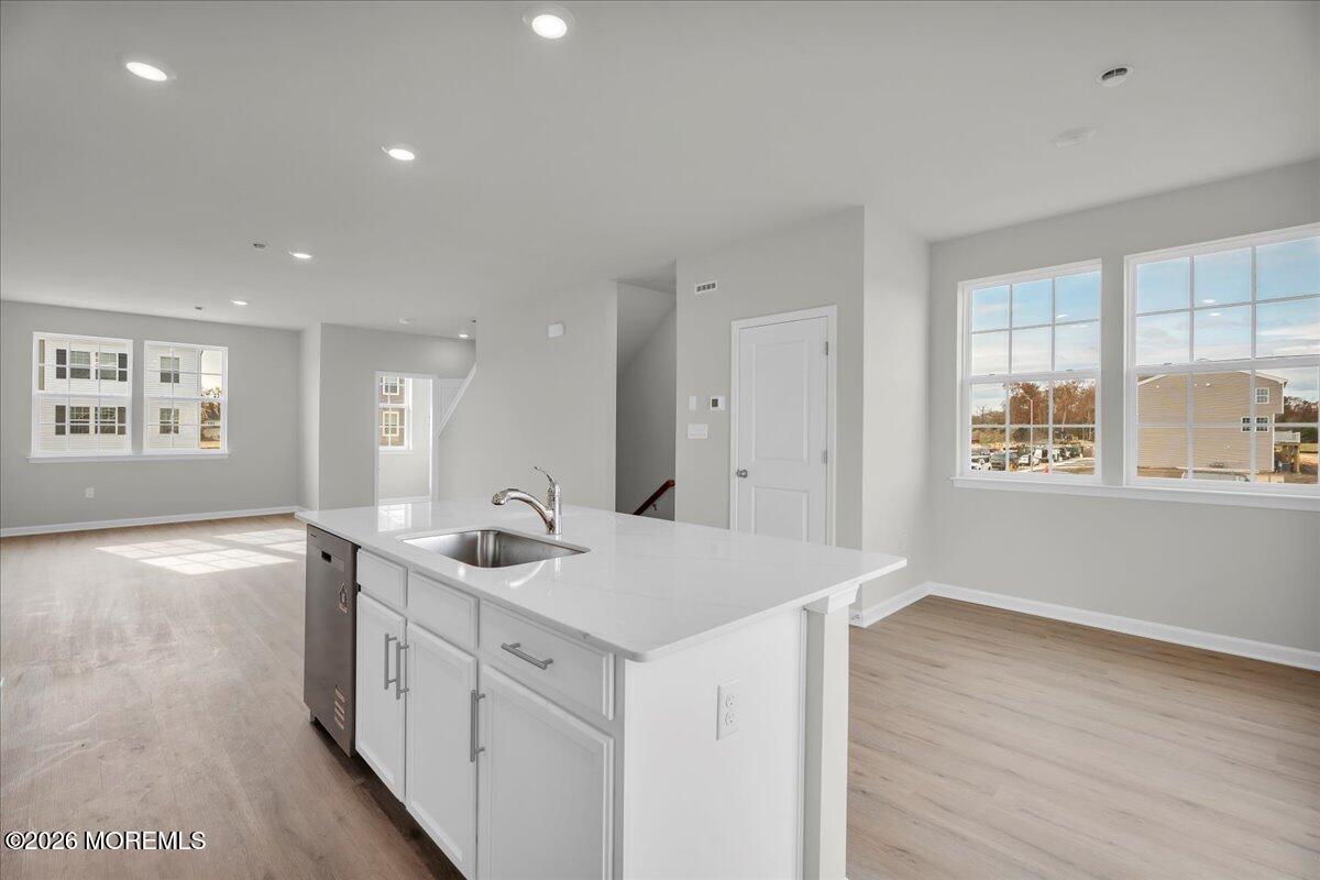 216 Sandy Rdg Road Sicklerville, NJ 08081 - Photo 5 of 24 a kitchen with a sink stove and cabinets