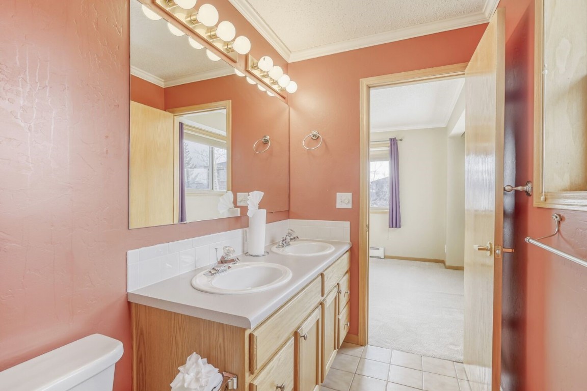 63 20 Grand Court, Unit 63 Silverthorne, CO 80498 - Photo 18 of 28 a bathroom with a sink a toilet and shower