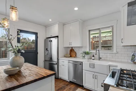 a bedroom with bed and a night stand