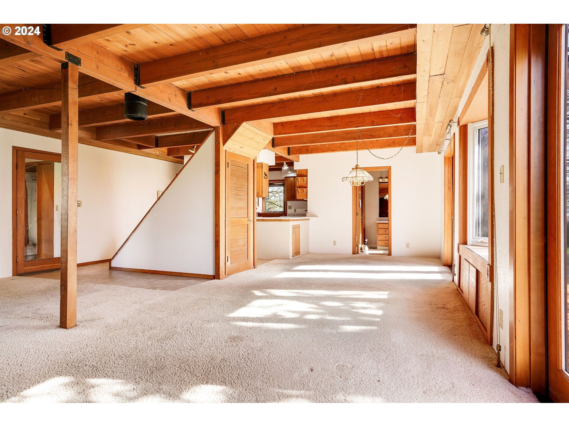 10342 Liberty Road South Jefferson, OR 97352 - Photo 13 of 40 a view of a hallway with wooden floor and windows