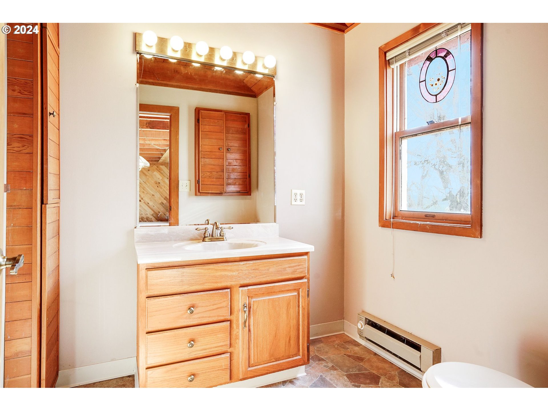 10342 Liberty Road South Jefferson, OR 97352 - Photo 21 of 40 a bathroom with a sink and a mirror
