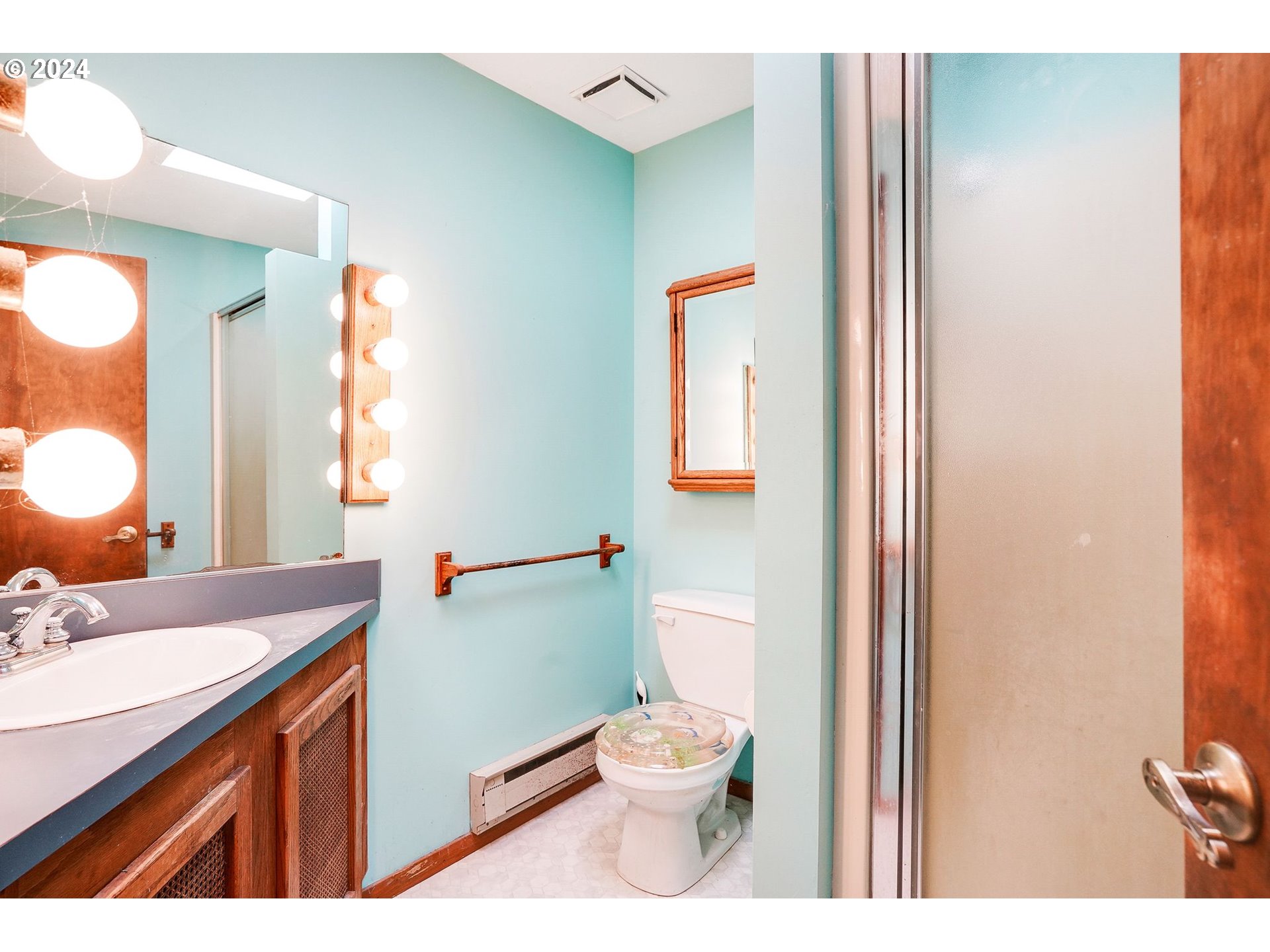 10342 Liberty Road South Jefferson, OR 97352 - Photo 26 of 40 a bathroom with a sink vanity mirror and toilet