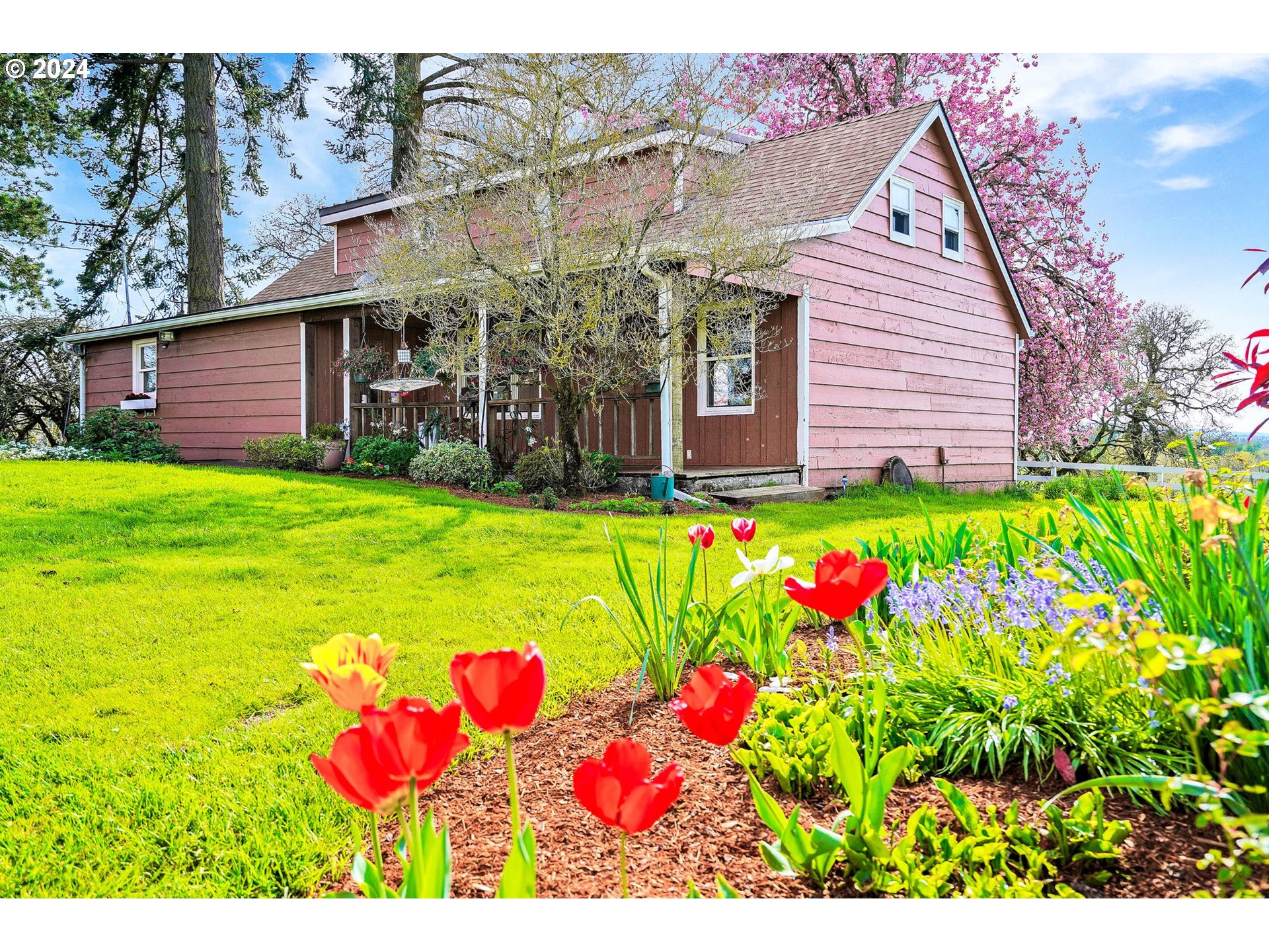 10342 Liberty Road South Jefferson, OR 97352 - Photo 6 of 40 a view of a flower in front of a house