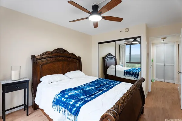 a bedroom with a bed and a closet