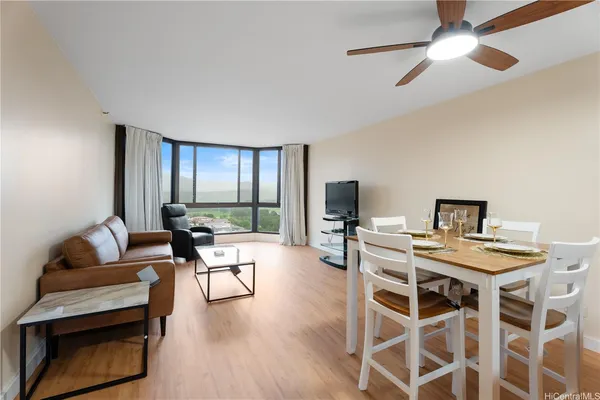 a view of a livingroom with furniture and a window