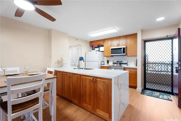 a kitchen with a sink cabinets and window