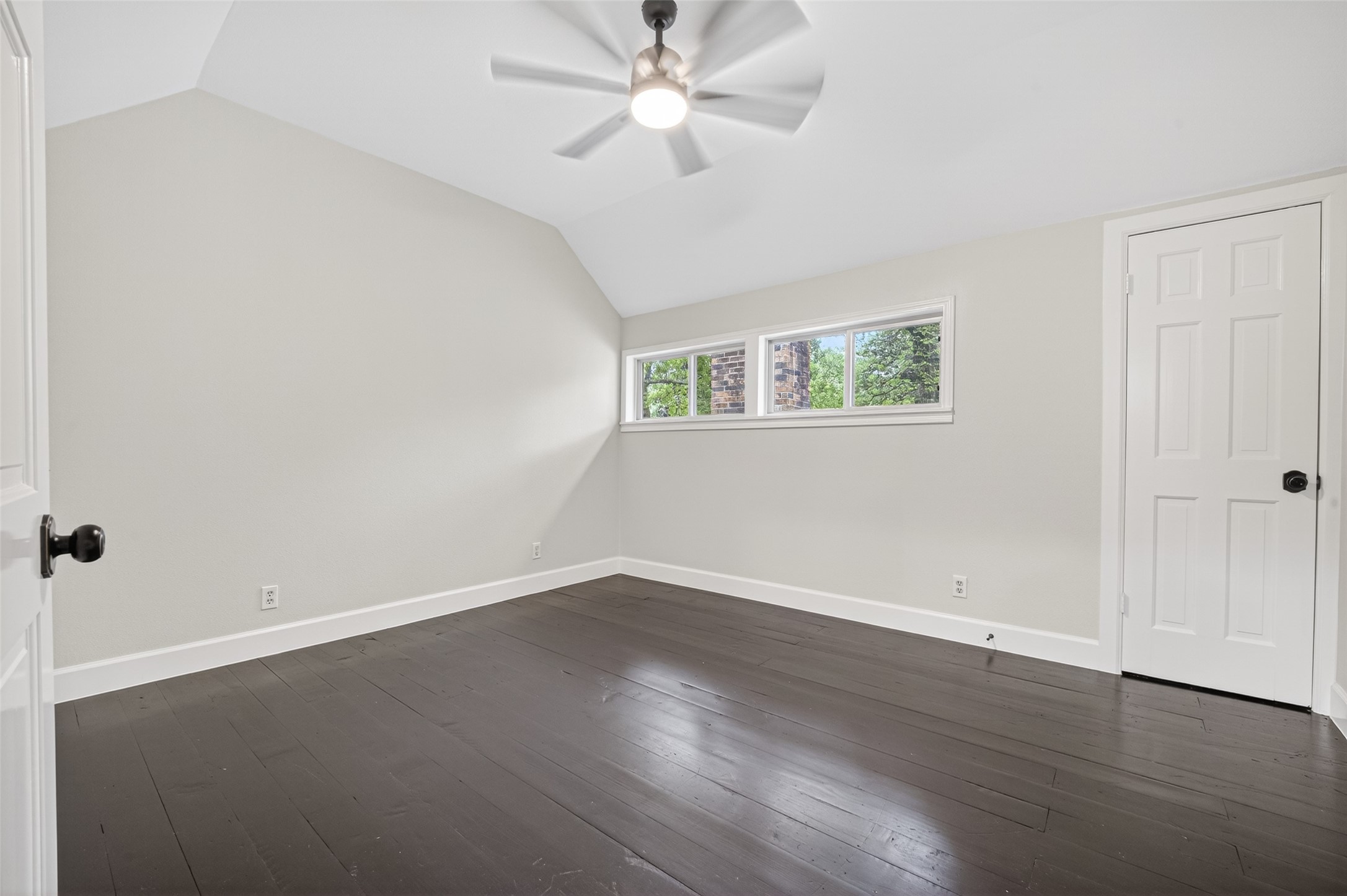 23607 Cardinal Drive Hockley, TX 77447 - Photo 31 of 50 High ceilings and rich wood flooring define this bedroom, offering a sense of volume and openness rare in traditional builds.