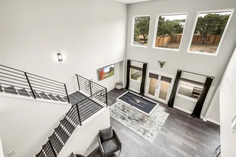 a view of living room and dining room with wooden floor