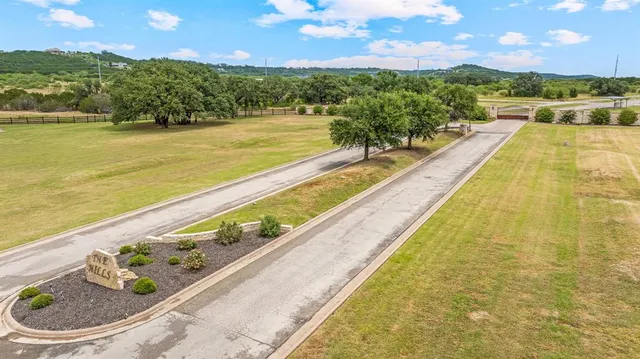 a view of swimming pool with outdoor seating and plants