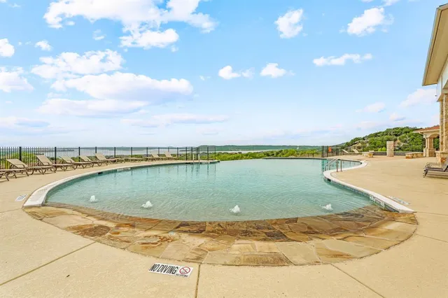 a view of a swimming pool and an outdoor space