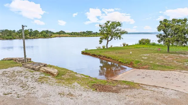 a view of a lake with a big yard