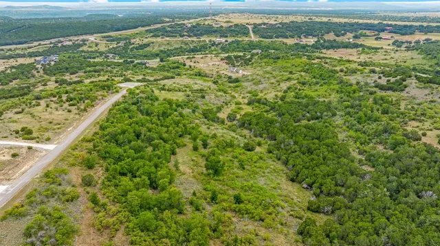 a view of a field with an ocean