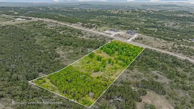 a view of a field with an ocean