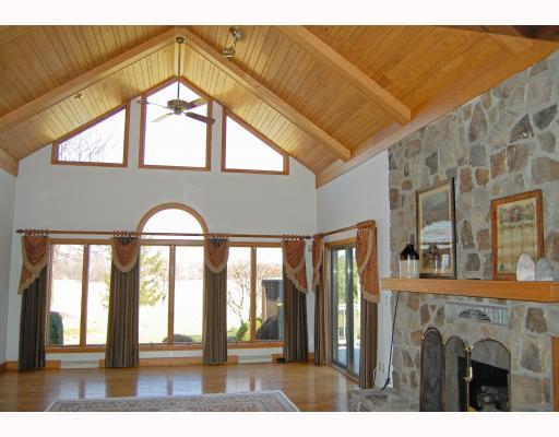 218 Pittsburgh Pike Ruffs Dale, PA 15679 - Photo 11 of 18 Den/Family/Great Room. The amazing family room features a wood & beamed cathedral ceiling and a beautiful stone see through fireplace.