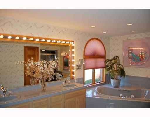 218 Pittsburgh Pike Ruffs Dale, PA 15679 - Photo 13 of 18 Master Bath/Spa. The spacious master bath features double bowl sinks an a jet tub - a great place to relax after a long hard day at work.