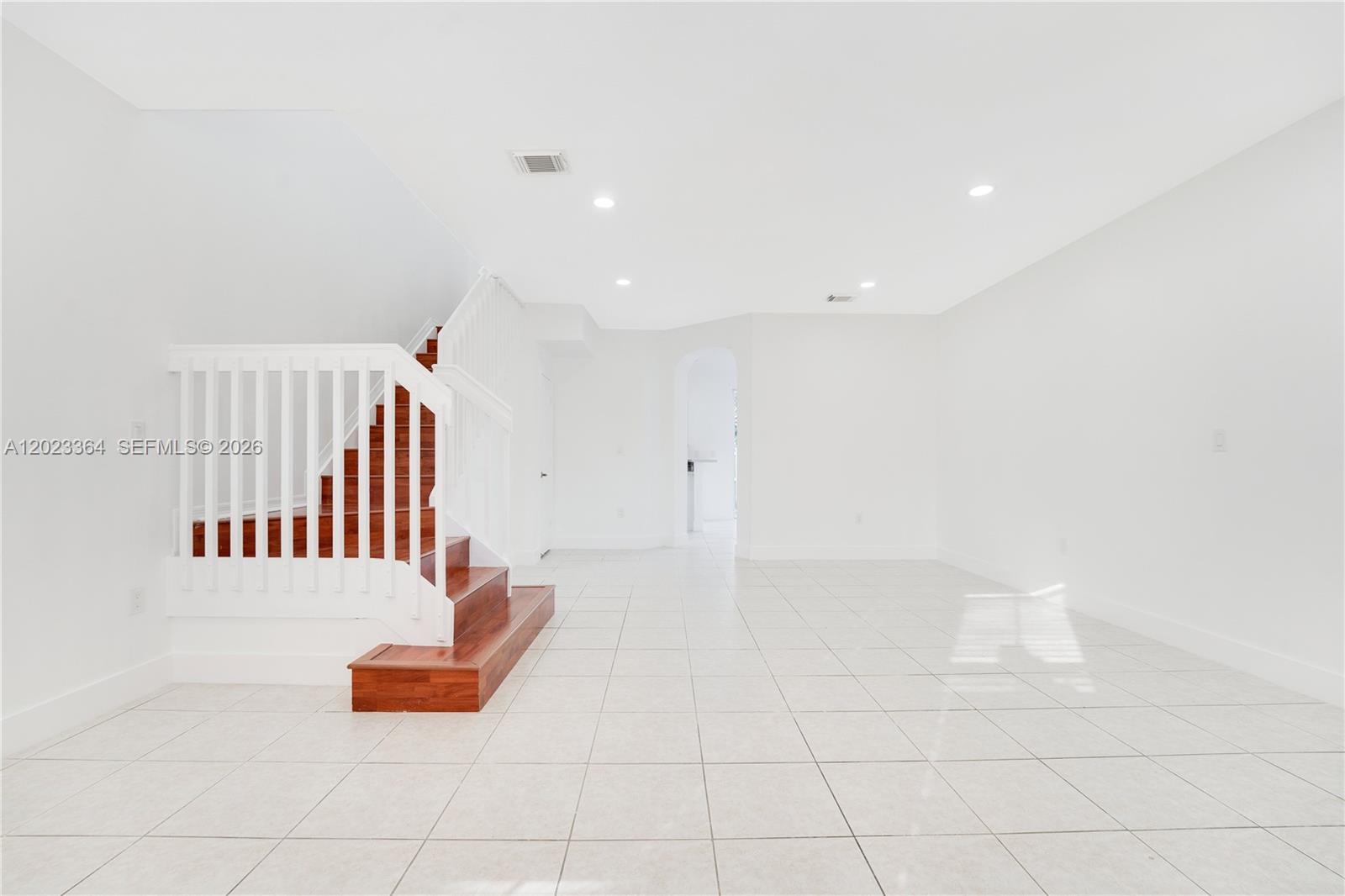 27433 Southwest 137th Court, Unit 1 Homestead, FL 33032 - Photo 3 of 28 a view of staircase with white walls