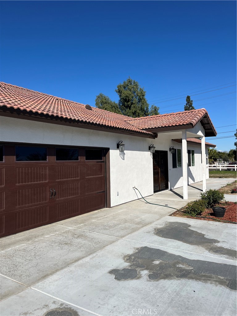 5836 Mitchell Avenue Riverside, CA 92505 - Photo 1 of 1 a front view of a house with a garage