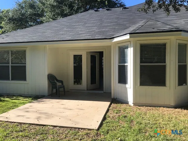 a view of a backyard of a house