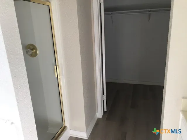 a bathroom with a glass door