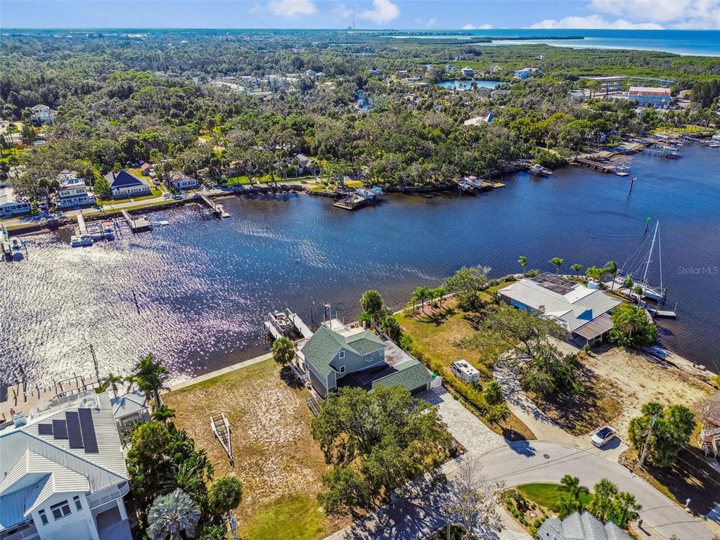 8025 Island Drive Port Richey, FL 34668 - Photo 16 of 67 an aerial view of a house with a lake view