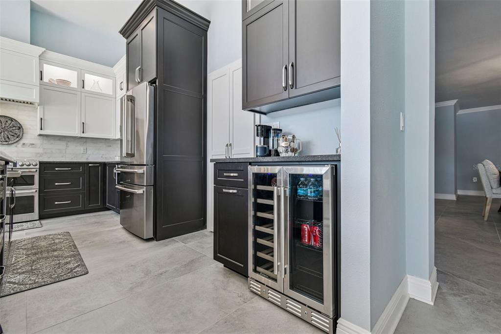 8025 Island Drive Port Richey, FL 34668 - Photo 32 of 67 a kitchen with stainless steel appliances granite countertop a refrigerator and a sink