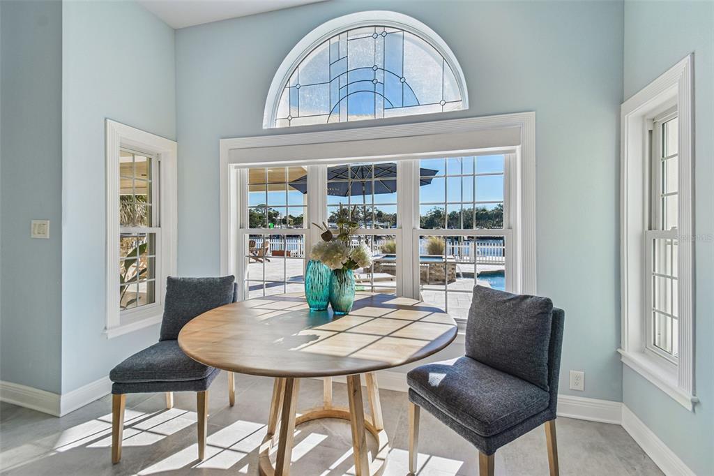 8025 Island Drive Port Richey, FL 34668 - Photo 34 of 67 a view of a dining room with furniture window and outside view
