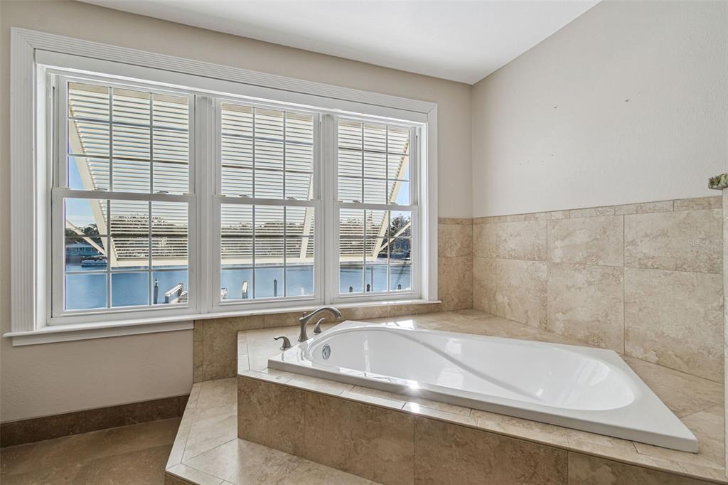 8025 Island Drive Port Richey, FL 34668 - Photo 45 of 67 a bath tub sitting next to a window