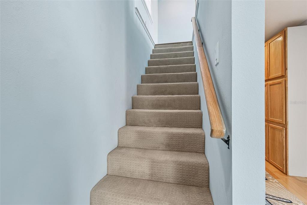 8025 Island Drive Port Richey, FL 34668 - Photo 51 of 67 a view of staircase with white walls