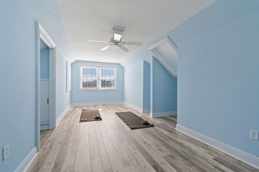 8025 Island Drive Port Richey, FL 34668 - Photo 52 of 67 wooden floor in an empty room with a window