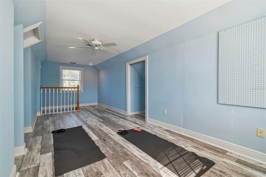 8025 Island Drive Port Richey, FL 34668 - Photo 53 of 67 a view of a bedroom with wooden floor
