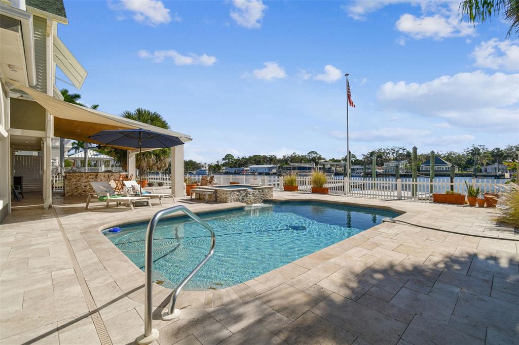 8025 Island Drive Port Richey, FL 34668 - Photo 55 of 67 a view of a patio with swimming pool