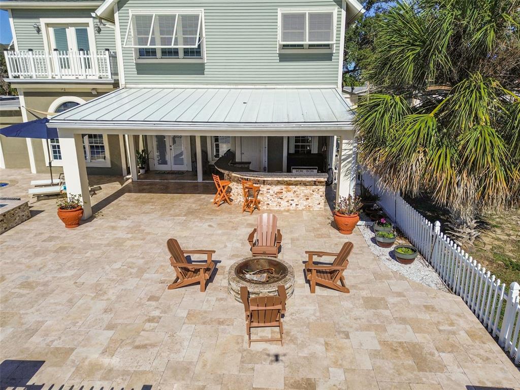 8025 Island Drive Port Richey, FL 34668 - Photo 57 of 67 a view of a patio with swimming pool table and chairs