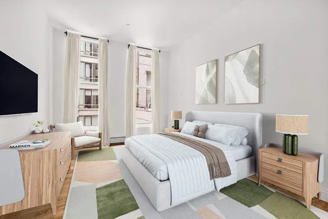 a kitchen with cabinets appliances and a sink